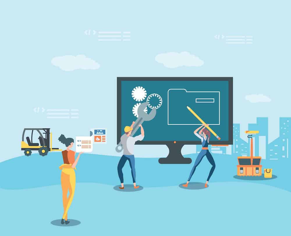 builders and desktop with webpage under construction